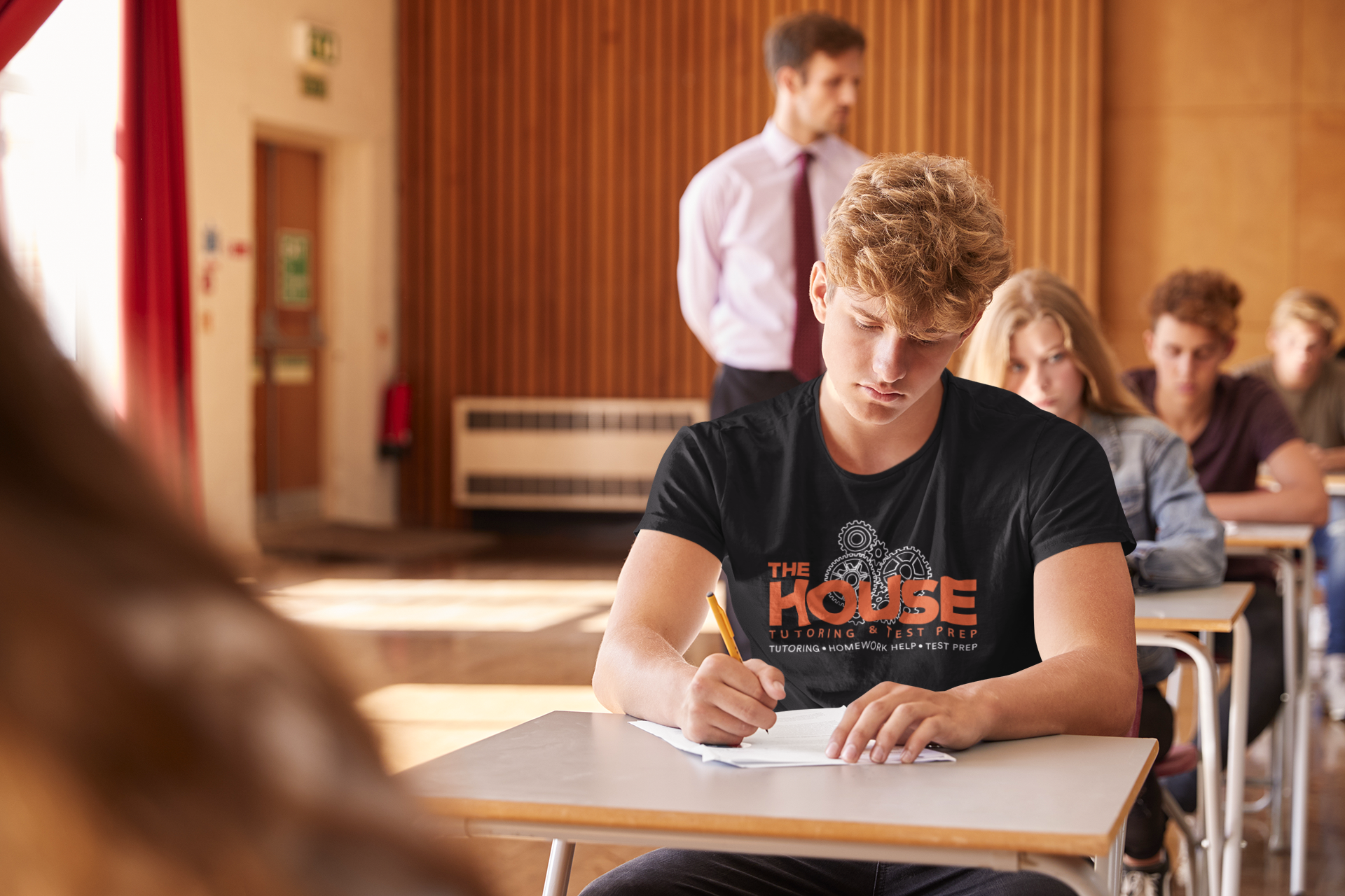 t-shirt-mockup-of-a-college-student-taking-an-exam-in-a-classroom-39183-r-el2